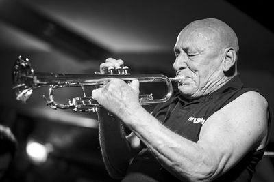 Close-up of man playing guitar