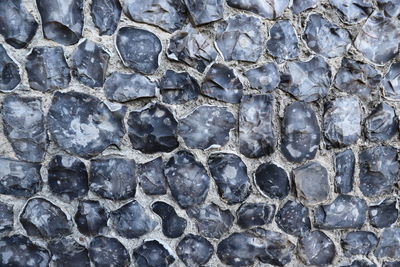 Full frame shot of flint stone wall.