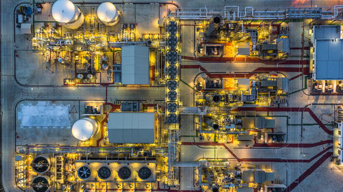 Directly above shot of illuminated factory in city at night