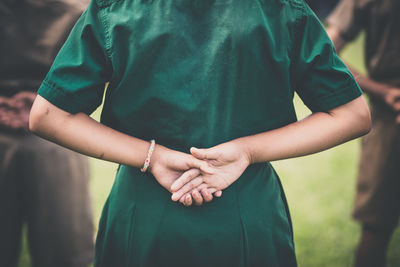 Midsection of woman standing in park