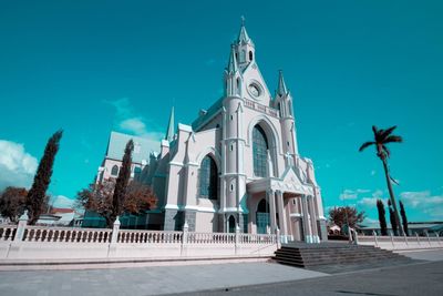 Low angle view of building against blue sky