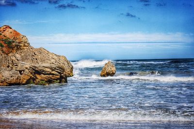 Scenic view of calm sea against blue sky
