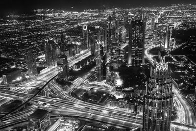 High angle view of illuminated city buildings at night