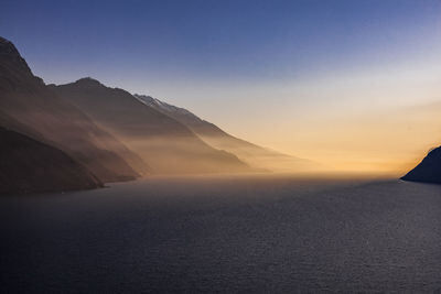 Scenic view of mountains against sky during sunset