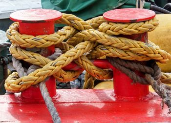 Close-up of rope tied on wooden post