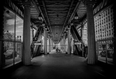 Underneath an illuminated subway tunnel