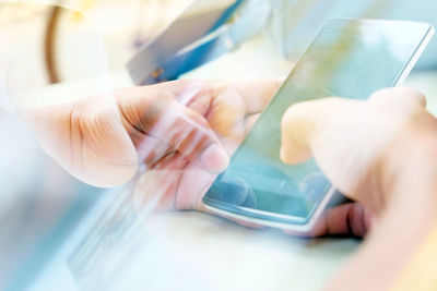 Close-up of hand holding smart phone