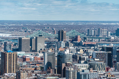 Aerial view of cityscape against sky