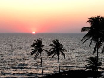 Scenic view of sea against clear sky at sunset