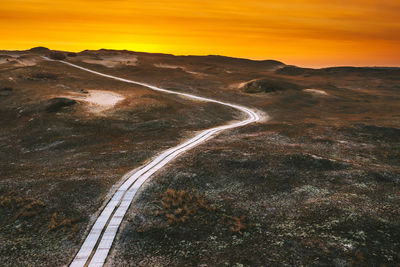 Scenic view of landscape against sky during sunset