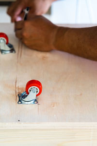 High angle view of castor wheels on table