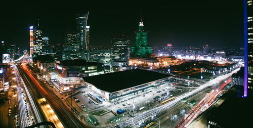 High angle view of city lit up at night