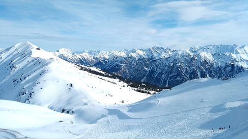 Scenic view of snowcapped mountains against sky