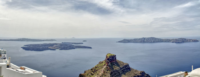 Panoramic view of sea and rock formation against sky