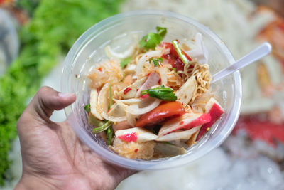 Close-up of hand holding food