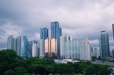 Modern buildings in city against sky