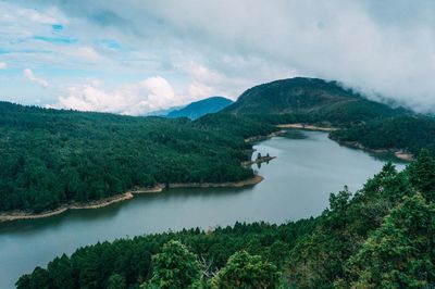 Scenic view of lake and mountains against sky