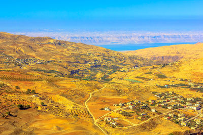 Scenic view of landscape against blue sky