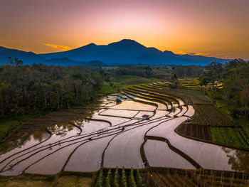 Scenic view of landscape against sky during sunset