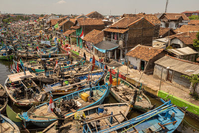 High angle view of fishing boats moored at beach