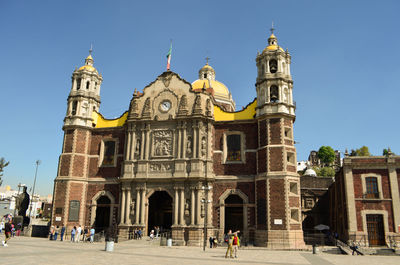 Facade of historic building against blue sky