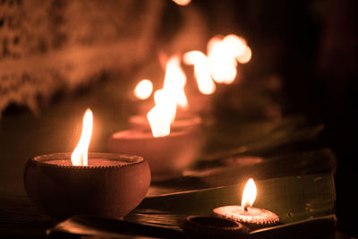 Close-up of illuminated diyas