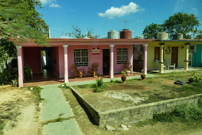 Built structure in lawn by building against sky