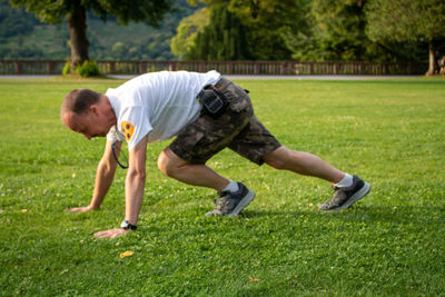 Full length of man playing with soccer ball