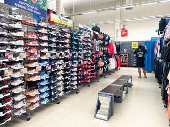 Stack of man standing in store