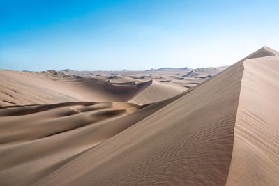 Scenic view of desert against sky at huacachina