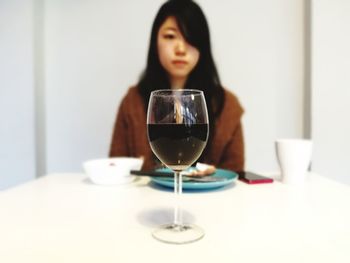 Woman sitting on table