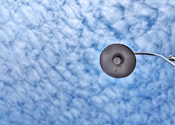 Low angle view of street light against sky