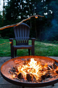 Close-up of bonfire on barbecue grill in yard