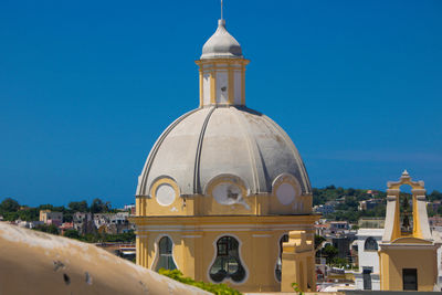 Low angle view of church against clear blue sky