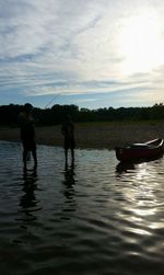 Boat in lake against sky