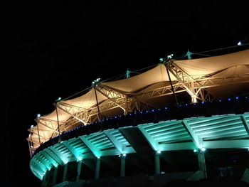 Low angle view of illuminated ferris wheel