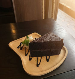 High angle view of chocolate cake in plate on table