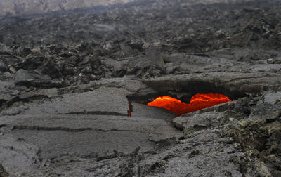 Glimpses of lava through a heart-shaped hole near iceland's newest volcano, geldingadalir