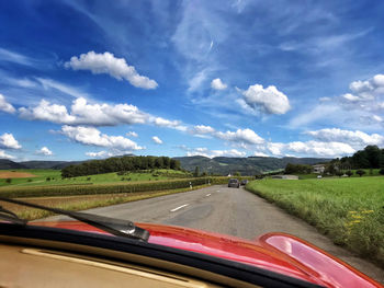Road seen through car windshield
