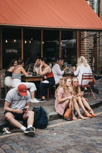 Group of people sitting in restaurant