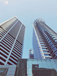 Low angle view of modern buildings against sky