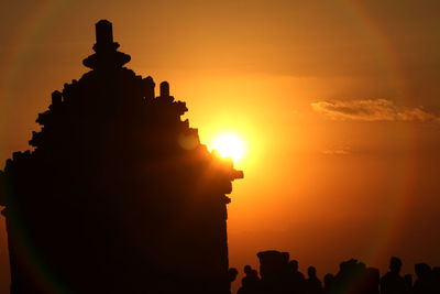 Silhouette temple against sky during sunset