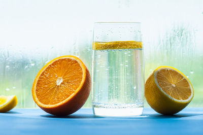 Close-up of orange juice on table