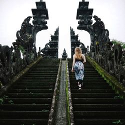 Low angle view of woman standing on steps