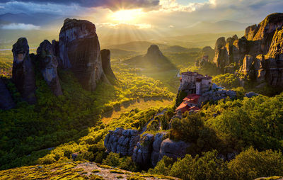 Scenic view of mountains against cloudy sky