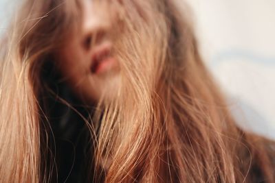 Close-up of woman with tousled hair
