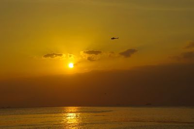 Scenic view of sea against sky during sunset