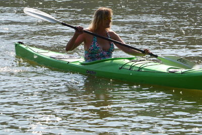 Woman in boat on lake