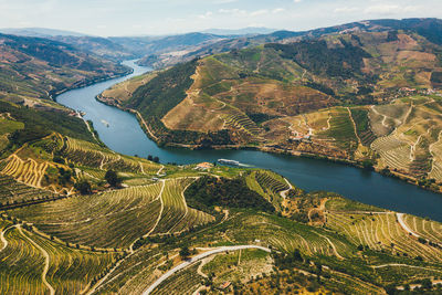 High angle view of river amidst mountains