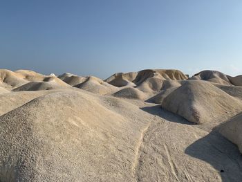 Scenic view of desert against clear sky